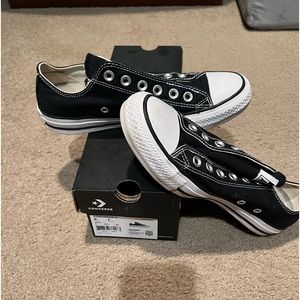 NEVER WORN Converse black classic Chuck Taylor All Star low top slip on.